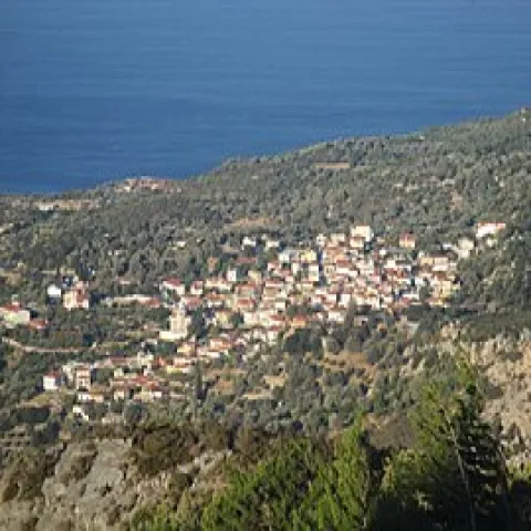 View from Koumaeika village in Samos with traditional houses and the Aegean horizon.